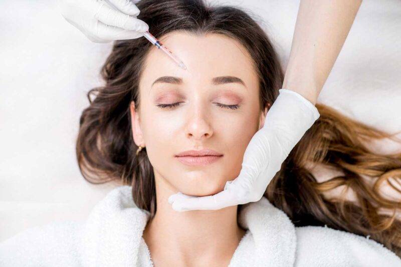 woman having a brow injection procedure performed