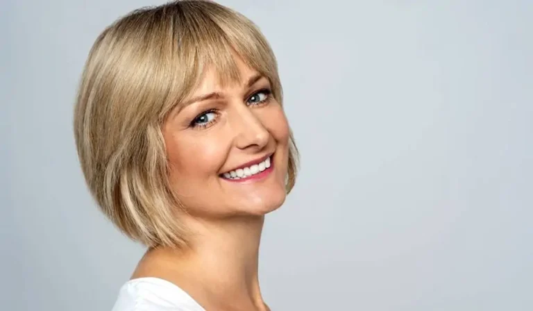 Beautiful middle aged woman likes her microneedling results.