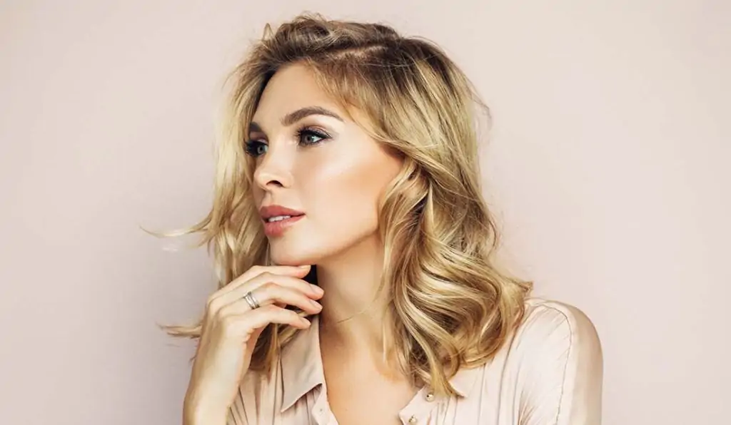 Blonde with beautiful skin looking left